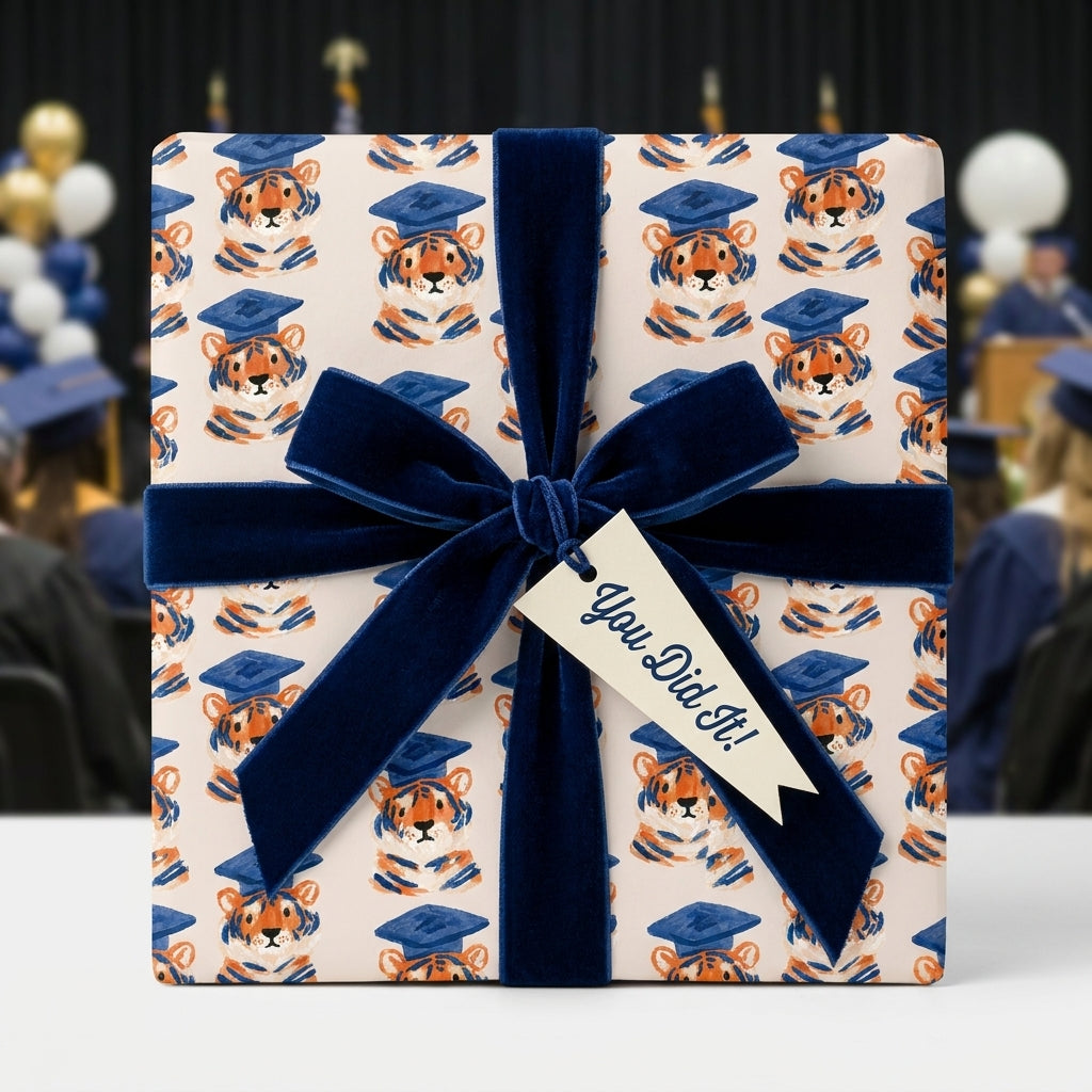 Cute tiger graduation wrapping paper with a navy velvet bow and You Did It tag by Wrapped Studios.