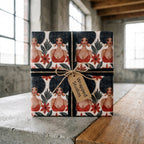 Afrocentric wrapping paper featuring Black women on a gift box with a Wrapped Studios tag.