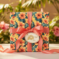 Gift box wrapped in floral Hibiscus wrapping paper with a coral ribbon and "A Special Gift For You" tag.