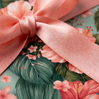 Tropical floral wrapping paper and luxury gift wrap with a pink satin bow by Wrapped Studios.