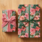 Luxury floral wrapping paper with pink hibiscus and velvet bow on gifts by Wrapped Studios.
