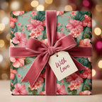 Luxury floral gift wrap by Wrapped Studios with pink hibiscus flowers and a dusty rose velvet bow.