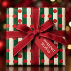 Red and green striped Christmas wrapping paper with polka dots and a red bow by Wrapped Studios.