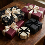 Luxury dark floral wrapping paper and burgundy gift wrap with elegant cream bows by Wrapped Studios.