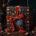 Elegant gift box wrapped in colorful floral wrapping paper with a velvet ribbon.