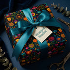 Wrapped Studios floral wrapping paper. A luxury gift wrap with teal ribbon on a square gift.