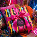 Bright "Party Time!" gift with modern wave print wrapping paper & fuchsia bow from Wrapped Studios.