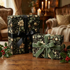 Wrapped Studios luxury Christmas gift wrap featuring black floral paper and velvet ribbon bows.