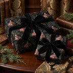 Elegant Christmas gifts wrapped in dark floral paper with red ornaments and black velvet ribbon.