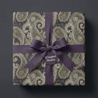 Luxury vintage paisley wrapping paper with a dark purple ribbon by Wrapped Studios.