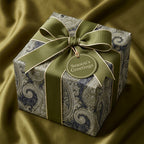 Luxury green paisley Christmas wrapping paper with a matching ribbon and gift tag by Wrapped Studios.