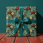 Luxury Christmas wrapping paper with floral pine pattern and teal satin bow by Wrapped Studios.
