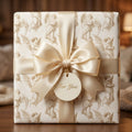Vintage angel Christmas gift wrap with luxury champagne satin bow by Wrapped Studios.