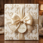 Vintage angel Christmas gift wrap with luxury champagne satin bow by Wrapped Studios.