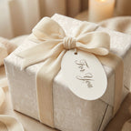 Vintage angel holiday wrapping paper with luxury cream velvet ribbon and gift tag by Wrapped Studios.