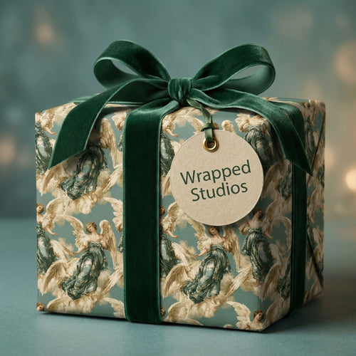 Vintage angel Christmas wrapping paper with a green velvet bow by Wrapped Studios.
