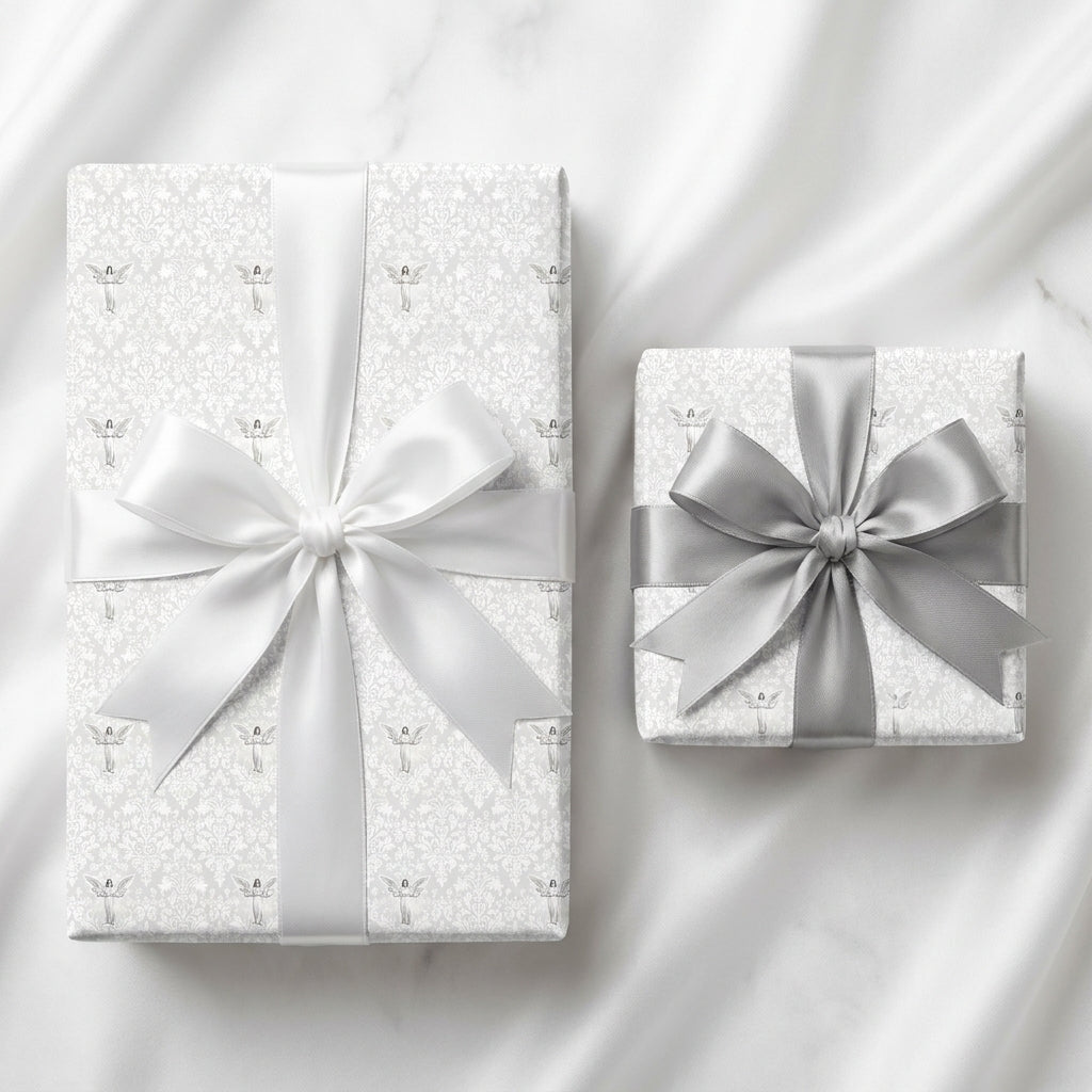 Elegant silver and white angel wrapping paper with satin bows, luxury gift wrap by Wrapped Studios.