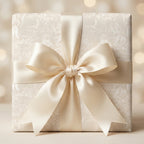 Elegant cream religious gift wrap with vintage angel pattern and satin bow by Wrapped Studios.