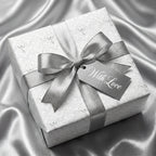 Luxury silver wedding wrapping paper with angel pattern and satin ribbon, by Wrapped Studios.