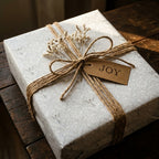 Grey vintage angel Christmas gift wrap with rustic twine bow and JOY tag by Wrapped Studios.