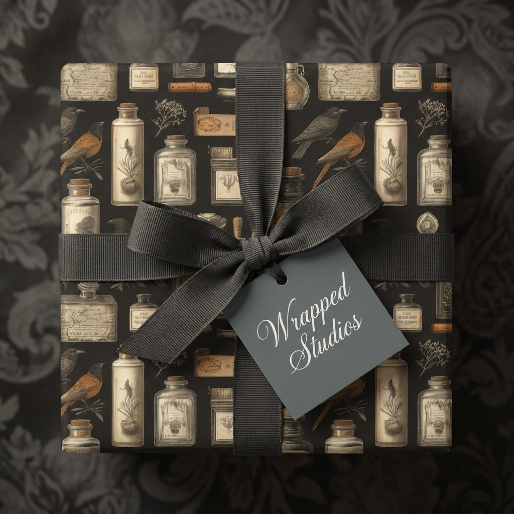 Elegant black gift wrap featuring vintage apothecary bottle and bird pattern with gray ribbon.