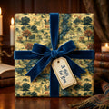 Elegant birthday wrapping paper with a blue velvet bow and scenic river and trees design.