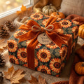 Sunflower wrapping paper on a rustic fall gift box with an orange velvet ribbon by Wrapped Studios.