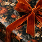 Luxury fall wrapping paper with a pumpkin botanical design and rust velvet bow by Wrapped Studios.