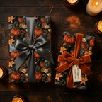 Moody fall pumpkin wrapping paper with luxury ribbons on a dark wood table, by Wrapped Studios.