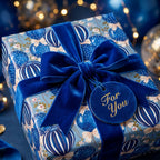 Luxury blue gift wrap featuring balloon illustrations and a blue velvet bow by Wrapped Studios.