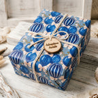 Blue hot air balloon wrapping paper by Wrapped Studios on a baby shower gift with an Adventure Awaits tag.
