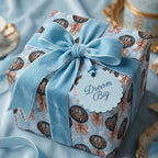 Hot air balloon baby shower wrapping paper with luxury blue velvet ribbon by Wrapped Studios.