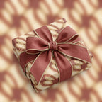 Vintage baseball wrapping paper with a burgundy bow on a sports gift wrap box by Wrapped Studios.