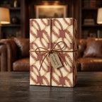 Vintage baseball wrapping paper with a leather bow on a gift box by Wrapped Studios.