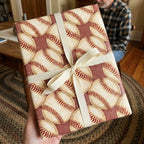 Vintage baseball wrapping paper with cream ribbon bow, sports gift wrap by Wrapped Studios.