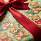 Vintage teddy bear Christmas wrapping paper with a red satin bow, by Wrapped Studios.