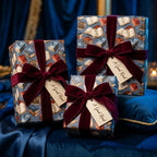 Vintage book wrapping paper with burgundy velvet ribbons on gifts by Wrapped Studios.