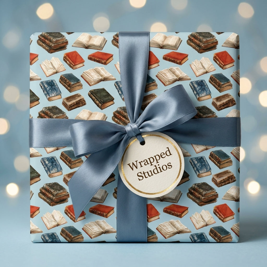 Vintage book wrapping paper with classic books and a dusty blue satin bow by Wrapped Studios.