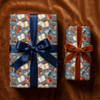 Vintage book wrapping paper on gift boxes with velvet and satin ribbons, by Wrapped Studios.