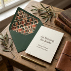 Literary wedding invitation with dark green vintage book envelope liner by Wrapped Studios.