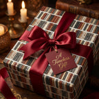 Vintage book wrapping paper with a luxury red ribbon and gift tag by Wrapped Studios.