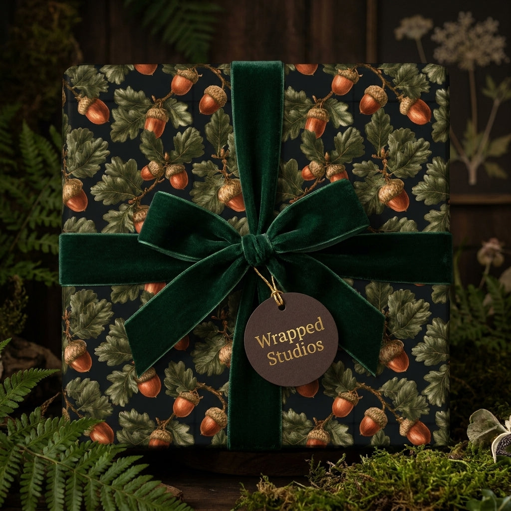 Rustic acorn woodland wrapping paper with a forest green velvet ribbon by Wrapped Studios.