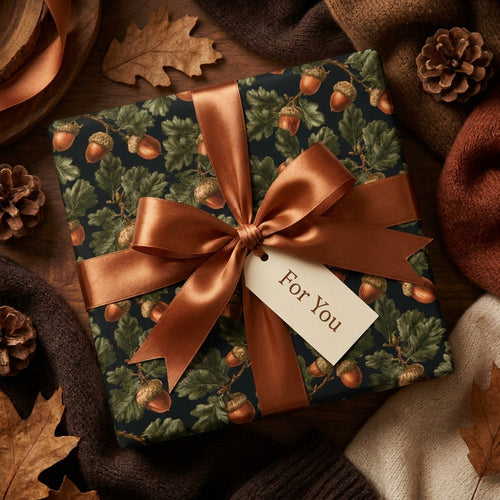 Luxury autumn wrapping paper with acorns and oak leaves, tied with a copper ribbon by Wrapped Studios.