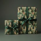 Two gifts wrapped in forest-themed Christmas wrapping paper with green ribbon.