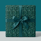 Luxury teal botanical wrapping paper with a matching satin ribbon by Wrapped Studios.