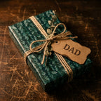 Green botanical Father's Day wrapping paper with rustic twine and Dad tag by Wrapped Studios.