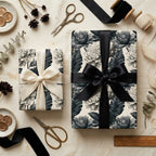 Elegant black and cream vintage floral wrapping paper by Wrapped Studios on gift boxes with satin bows.