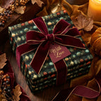 Luxury gift wrap with apothecary bottles, burgundy velvet bow & 'With Love' tag. Perfect for holiday gifts.