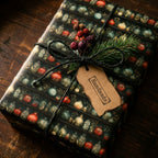 Dark botanical apothecary wrapping paper with colorful potion jars, tied with twine, fir sprig & berries. Unique rustic Christmas gift wrap.