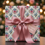 Luxury floral wrapping paper featuring a dusty pink satin bow and gift tag by Wrapped Studios.